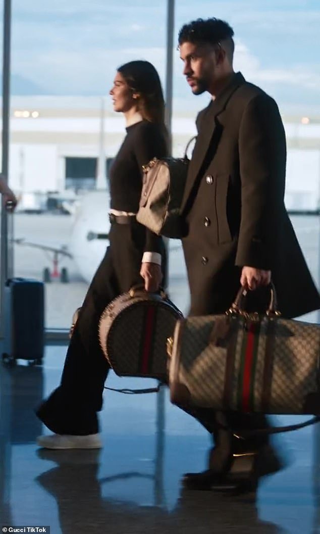 Gucci girl and boy: The A-list couple were dressed from head to toe in Gucci as they showed off pieces of the luggage from the Italian fashion house's Valigeria campaign