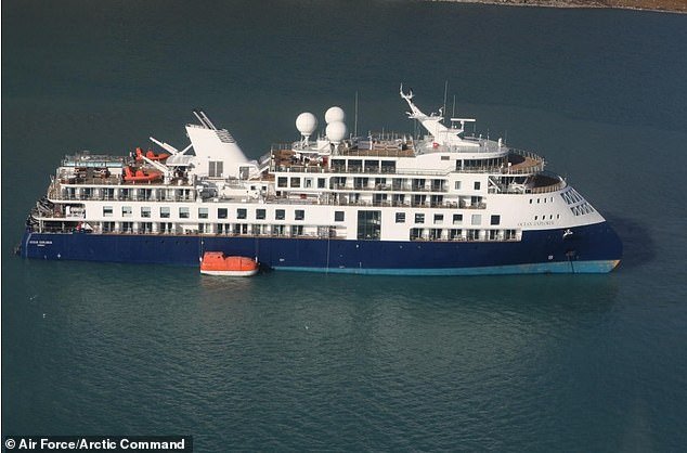 90 Aussies are aboard the Ocean Explorer (pictured on Tuesday) which is grounded in remote Greenland