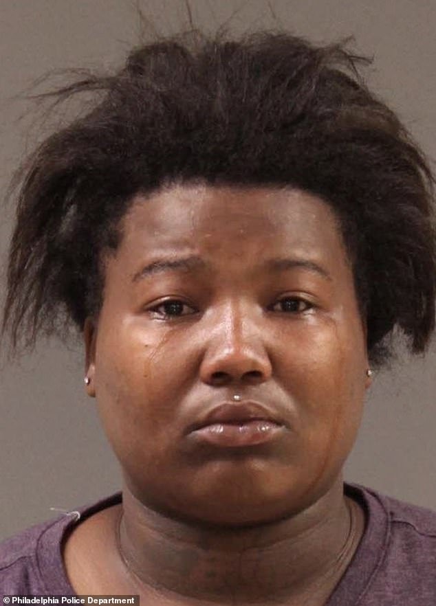 Looter Dayjia Blackwell, who livestreamed a looting spree in Philadelphia and encouraged others to join in, appeared distraught as police took her mugshot