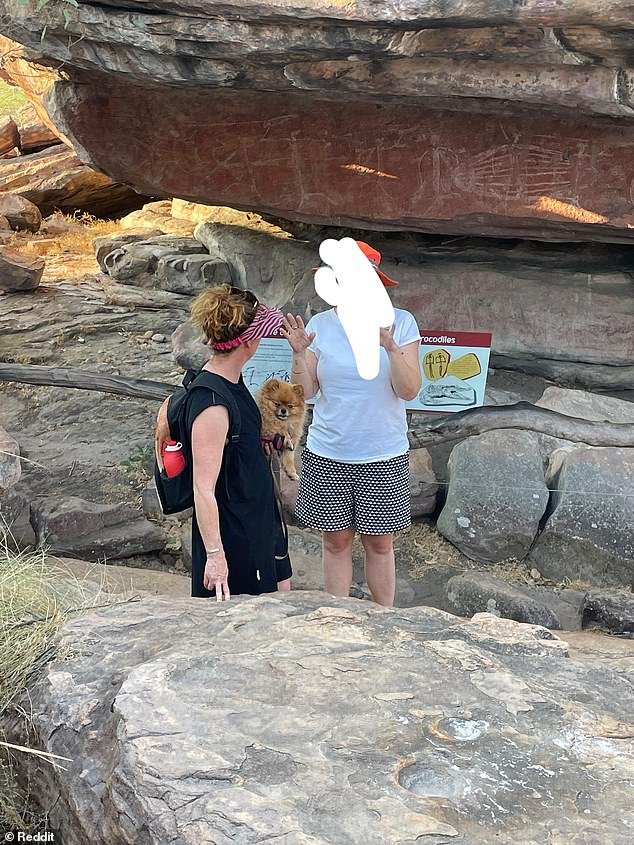 Two visitors (pictured centre) were criticized for taking their dogs to Kakadu National Park