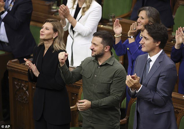 Canadian Prime Minister Justin Trudeau (pictured far right) apologized Wednesday for Parliament's recognition of a man who fought alongside the Nazis in World War II