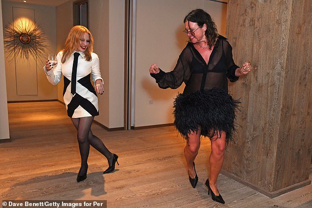 Time for a party!  Kylie had a drink in her hand as she put her best foot forward and danced the night away with fashion journalist Katie Grand at the party