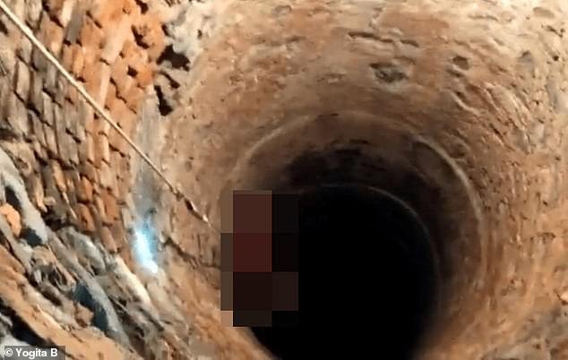 A 15-year-old girl has been brutally raped, murdered and dumped in a 15-metre deep well in India's latest shocking sex attack.  In the photo: The body bag, which is muzzled, is lifted out of the well