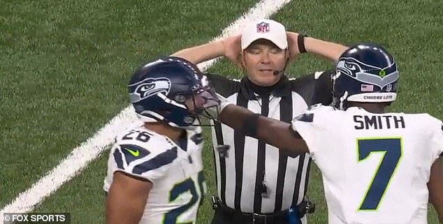 NFL referee Alex Kemp went viral Sunday night for his conversation with Geno Smith