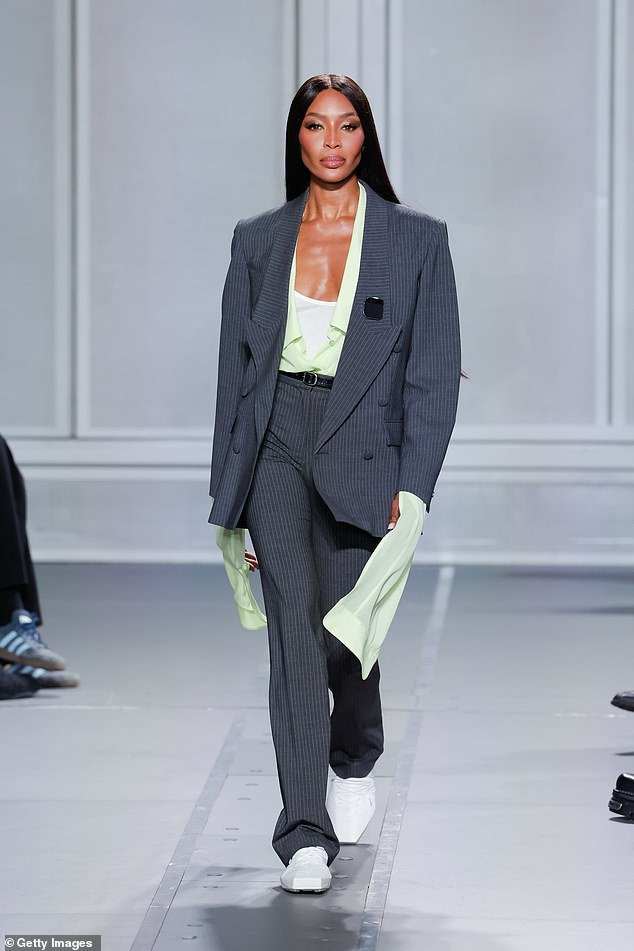 So chic: Naomi Campbell, 53, looked sensational in a gray pinstripe suit as she walked into the Coperni Womenswear Spring/Summer 2024 show during Paris Fashion Week on Friday