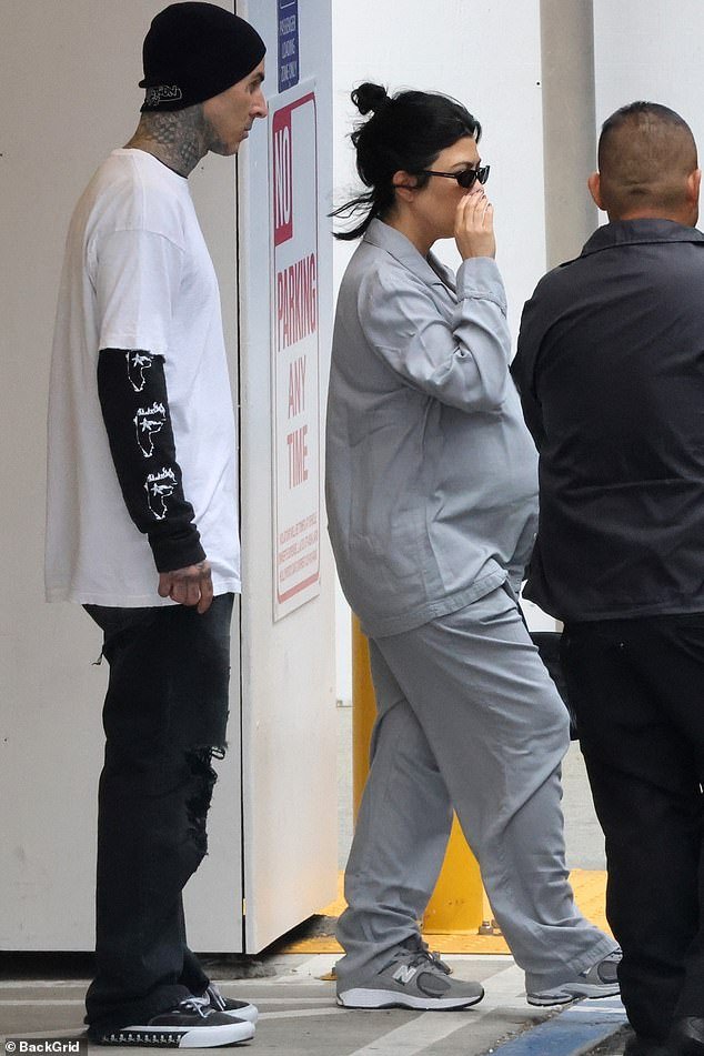 On the road: A still heavily pregnant Kourtney Kardashian and her husband Travis Barker were spotted coming out of a Los Angeles hospital on Saturday