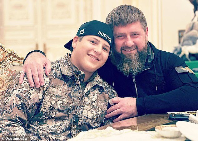 Adam Kadyrov is one of the fourteen children of the ruthless warlord.  They are pictured together above