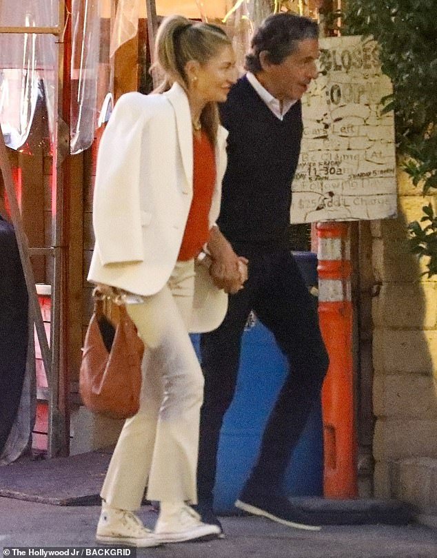 In love: Rebecca Gayheart, 52, looked smitten as she walked hand in hand with beau Peter Morton, 76, in West Hollywood on Monday