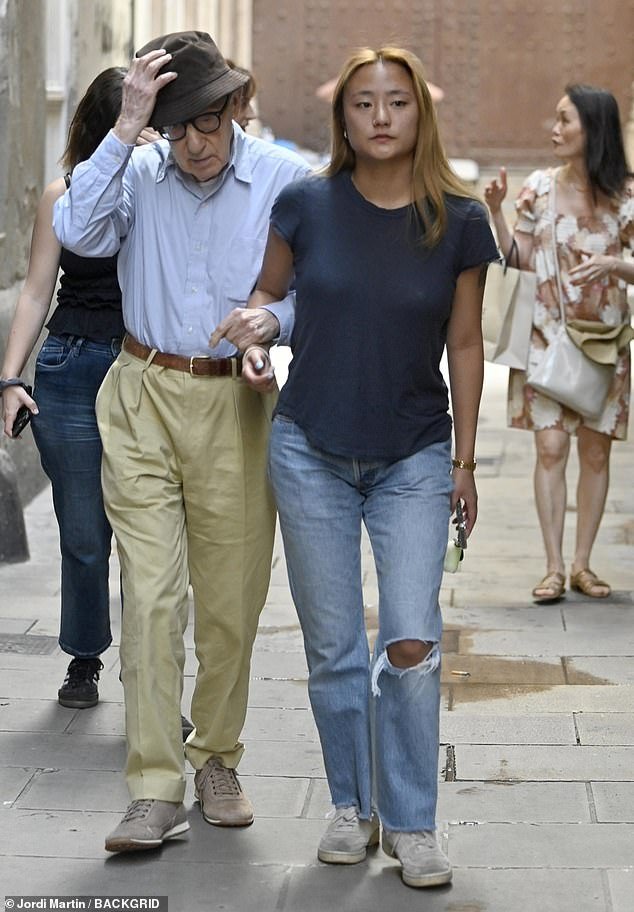 Stepping out: The noise that his final red carpet appearance inevitably caused had died down on Monday as Woody Allen enjoyed a day out with his family in Barcelona
