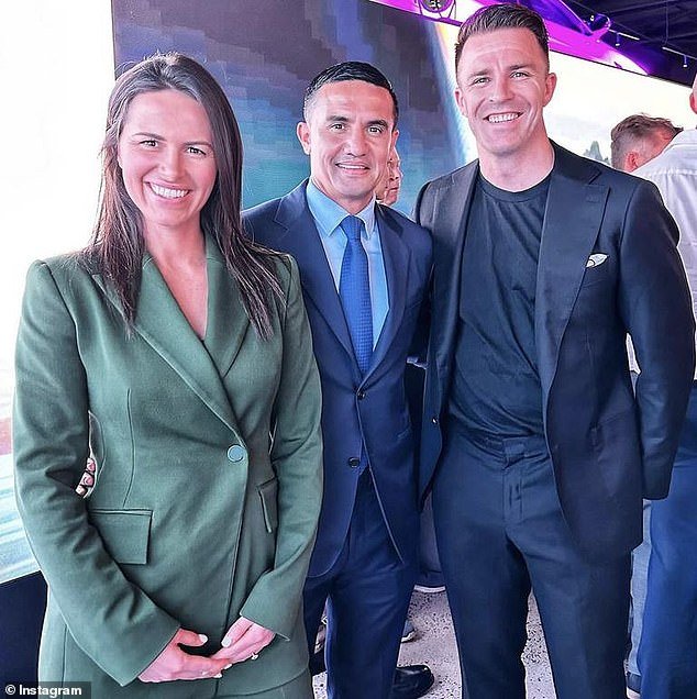 The couple were last seen together in public at an event to launch BYD's new electric car and showroom in Alexandria (pictured with football legend Tim Cahill, centre)