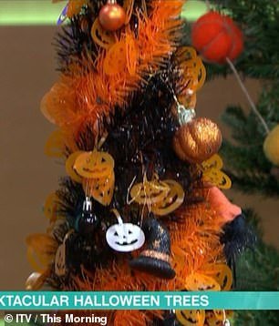 Setup: In the TV studio, several trees were set up and decorated with Halloween-themed ornaments