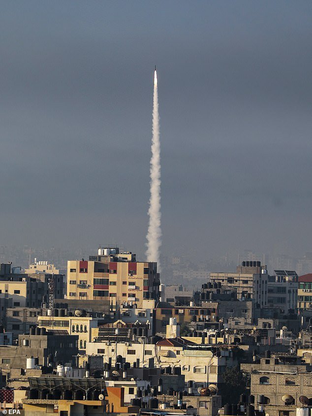 A rocket is fired from the Gaza Strip towards Israel by militants of the Ezz Al-Din Al Qassam militia, the military wing of the Hamas movement, in Gaza City.