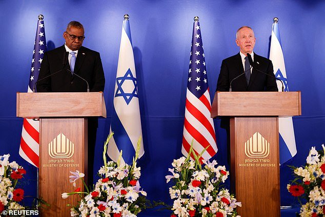 US Defense Secretary Lloyd Austin, pictured left in March with his Israeli counterpart Yoav Gallant, said America could 'further strengthen' its military presence in the region 'if required'