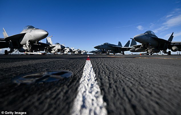 F-18 jet fighters are seen on the flight deck of the USS Gerald R. Ford on November 17, 2022 in Gosport, England