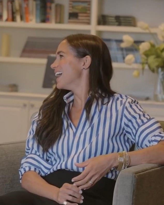 In a clip shown during an Invictus workshop on Monday, Meghan - wearing a striped Ralph Lauren shirt and black skirt - is seen meeting and hugging veterans' families.