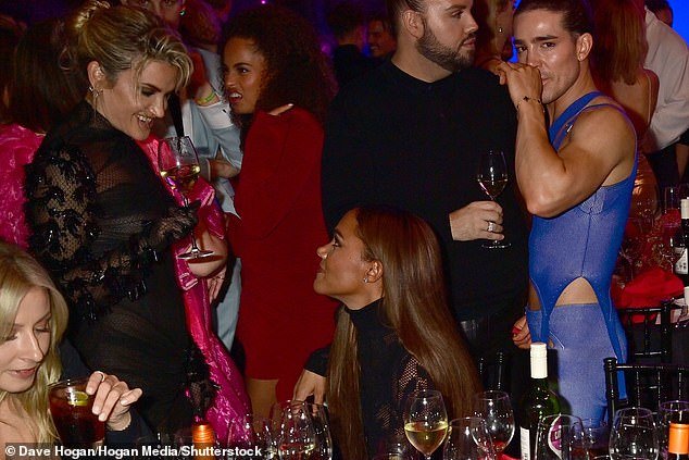 Catching up: However, later in the evening, the rumored couple were spotted sitting next to each other as they chatted to other guests, including Ashley Roberts (pictured)