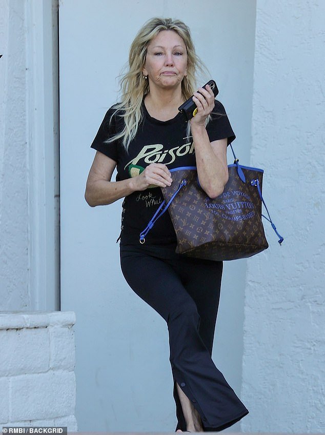 Casual cutie: The Melrose Place icon added to the casual style, slipping on a set of trainers while going practically make-up free