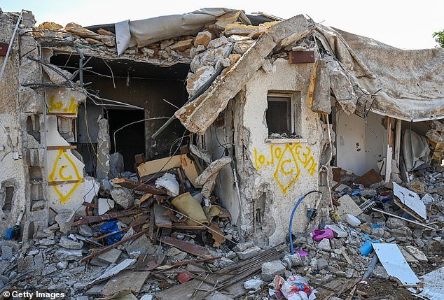 A house that was left in ruins after an attack by Hamas militants on this kibbutz days earlier when dozens of civilians died near the border with Gaza on Tuesday.