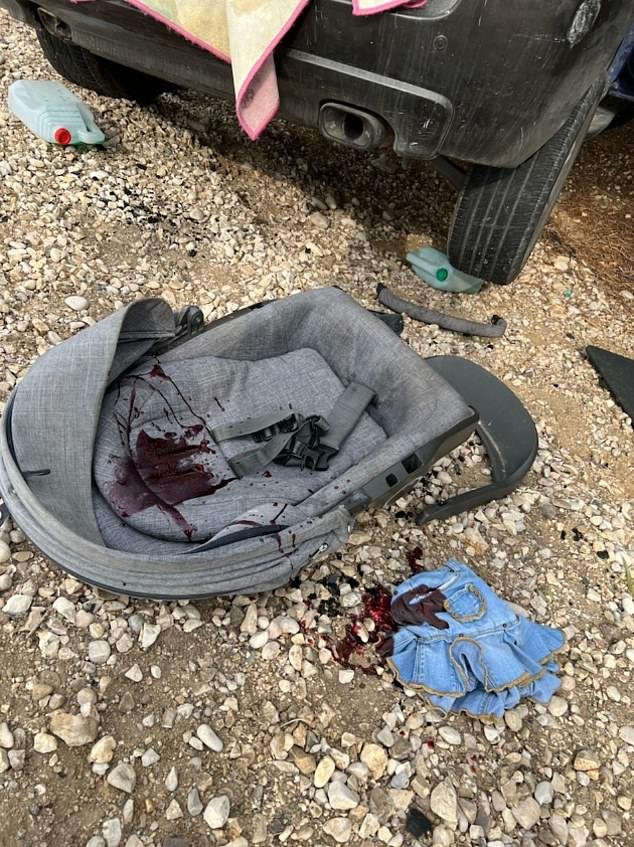 A baby seat and child's dress are seen in the aftermath of a bloodied Hamas attack