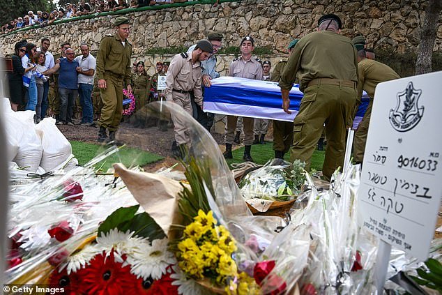 Other political leaders have refrained from criticizing Israel or its leaders, while it continues to bury its dead.  Soldiers are seen here carrying the coffin of Valentin Ghnassia, 23, who was killed in a battle with Hamas militants at Kibbutz Be'eeri near Israel's border with the Gaza Strip during his funeral on October 12, 2023 at the Mount Military Cemetery Herzl in Jerusalem