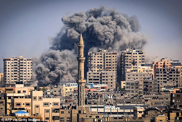 Smoke billows during Israeli airstrikes in Gaza City on Thursday
