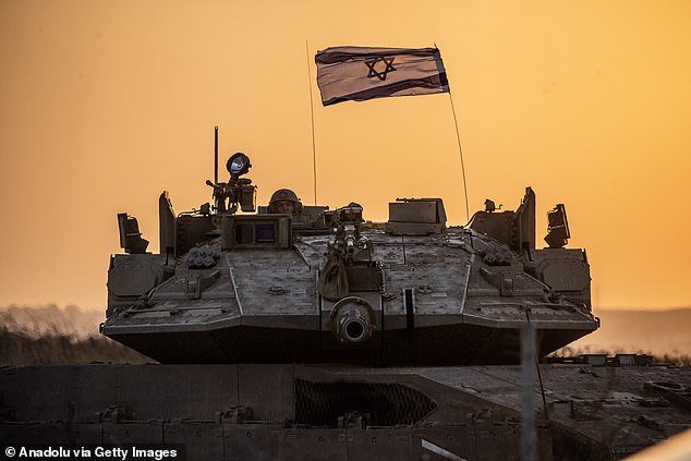 Israeli tanks move near the Gaza border as the Israeli army deploys military vehicles around the Gaza Strip, Israel on October 12, 2023