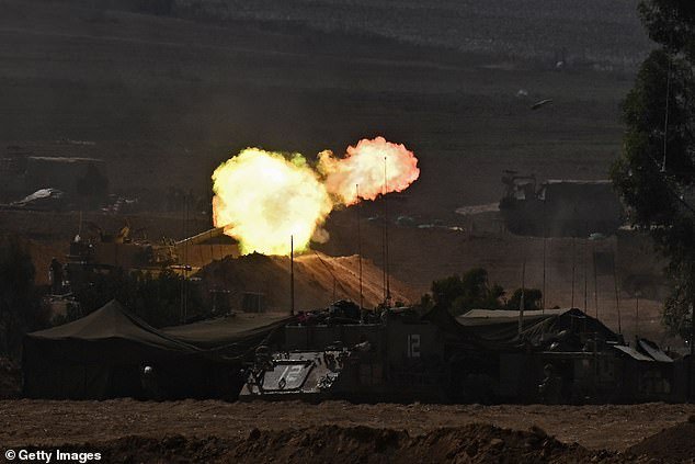Israeli artillery firing into the Gaza Strip from the border on October 12, 2023