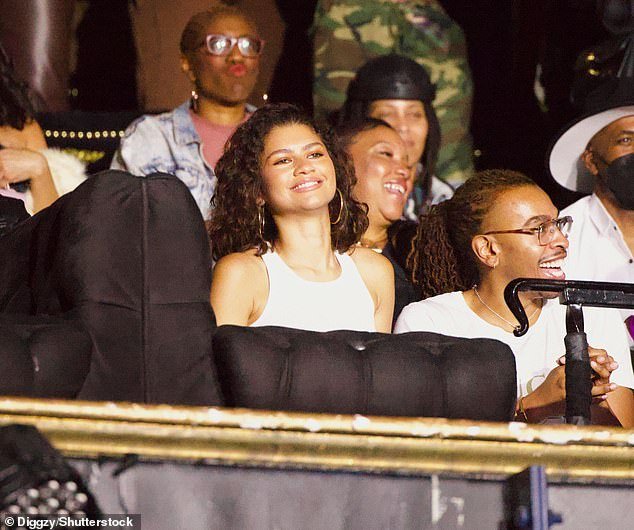 Effortlessly stylish: Dressed casually for a night out, Zendaya went braless under a white vest which she paired with jeans