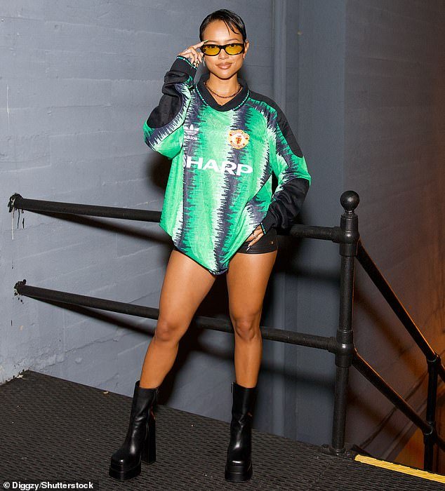 Supportive friends: Karrueche Tran also attended the show and showed off in an oversized football shirt and platform boots