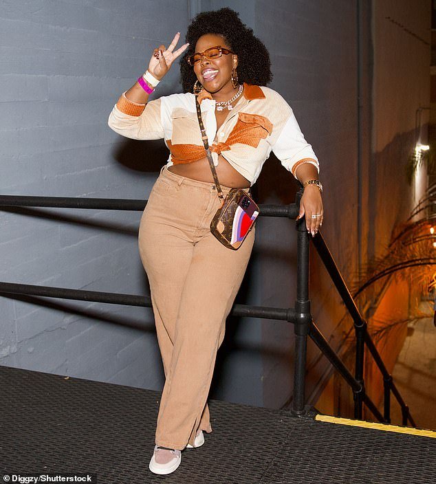 One to know: Glee's Amber Riley, now enjoying success as a solo artist, wore high-waisted pants with a long-sleeved shirt that she unbuttoned and tied in a knot