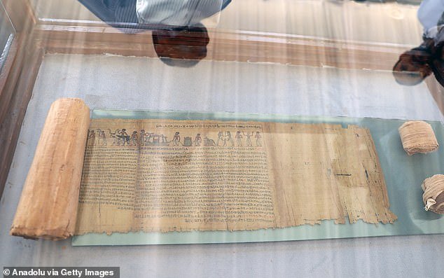 Text: A papyrus containing the Book of the Dead (pictured) was also discovered.  It is about 50 feet (15 meters) long.