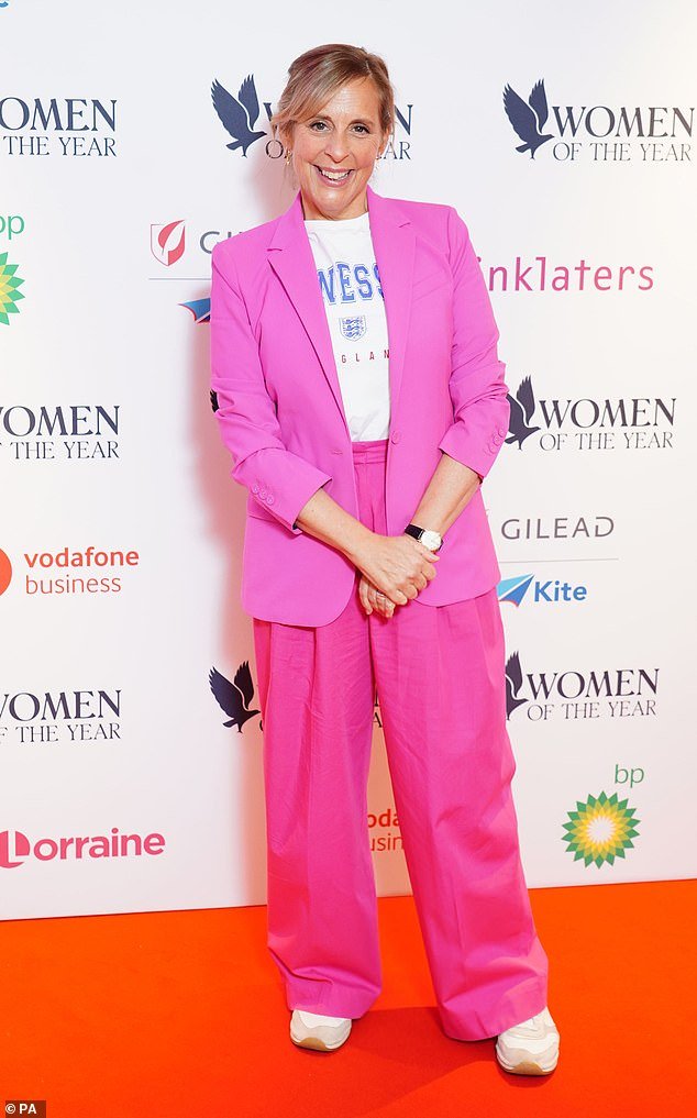 Stylish: Mel wore a striking pink blazer and wide leg trousers teamed with a white T-shirt