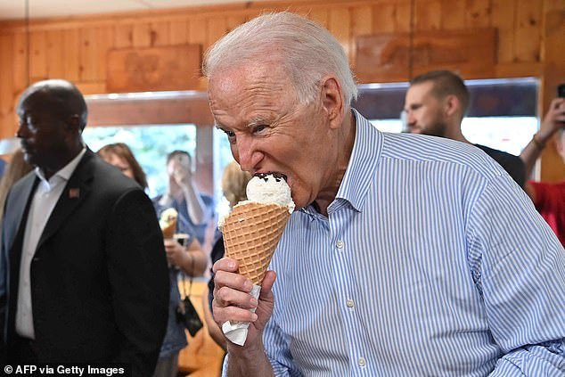 Joe Biden enters an ice cream parlor in Michigan