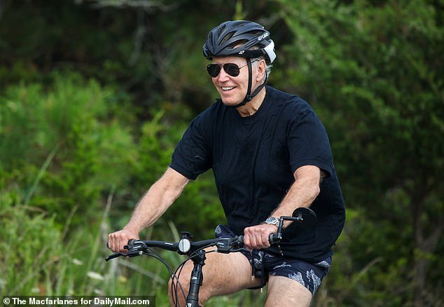 Joe Biden on his bike in Delaware, where he was on the 300th day of his presidency