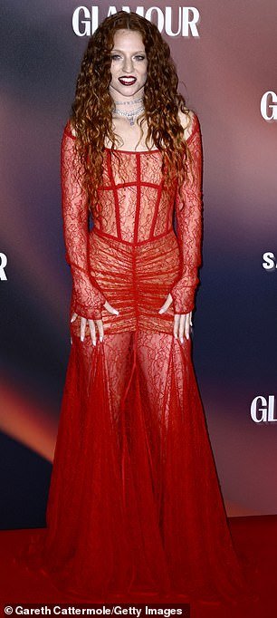 Glamor kitty: Alex's reported singer Jess, 33, wore a semi-sheer red dress with lace detailing at the glittering event