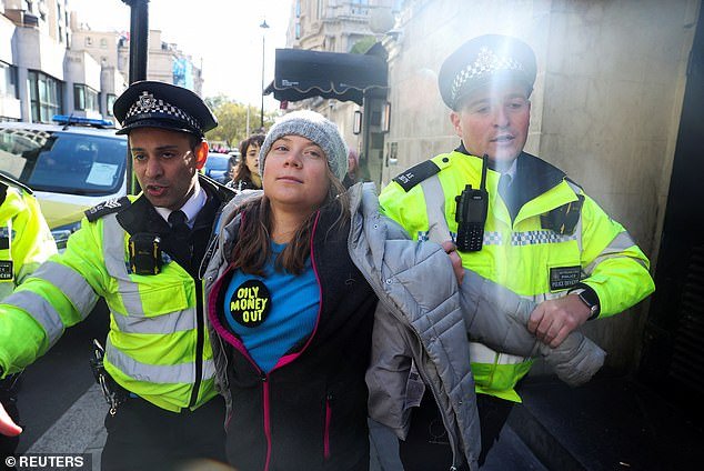 The activist, who wore a large badge reading 'Oily Money Out', was one of 26 people arrested at the rally