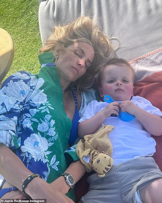 Honest: The 50-year-old also shared a snap of Frida caught sleeping next to her son as she looked a little unimpressed to wake up