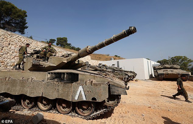 Israeli soldiers and armored vehicles are in position along the Israel-Lebanon border