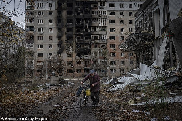 A resident is seen after shelling in the frontline town of Avdiivka as the Russian-Ukrainian war in Avdiivka continues