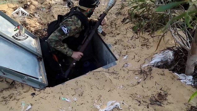You can see the armed terrorists emerging from hatches hidden by sand, bushes or makeshift barriers