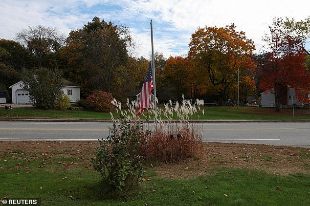 An American flag flies at half-mast after a deadly mass shooting in Lewiston, Lisbon Falls, Maine