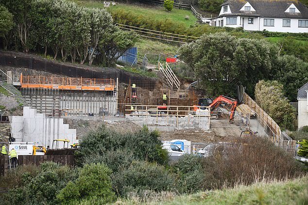 Photos show that construction work is taking place on the plot