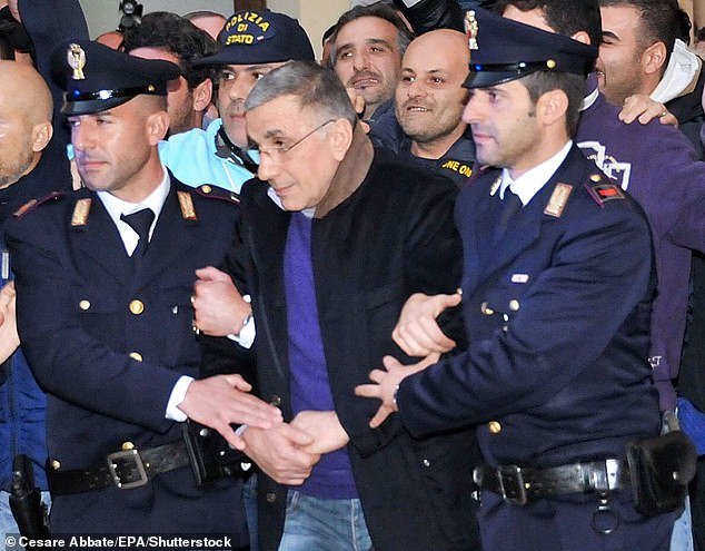 Mafia boss Michele Zagaria of the Casalesi clan was escorted from police headquarters in Caserta, Italy, in 2011.  His clan was one of the most feared families in the Camorra