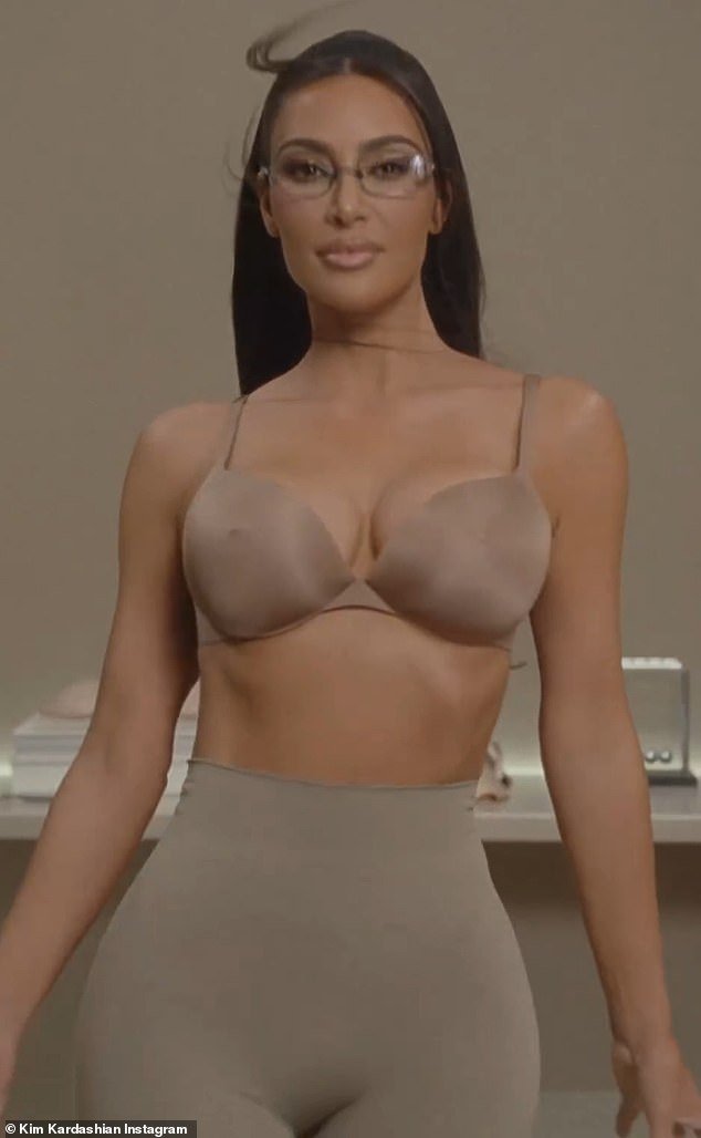 Power nipple: The reveal took place on Friday morning, with Kim herself modeling the new bra in an office setting during a cheeky video.  Kim is wearing an all-nude outfit, as she has the 