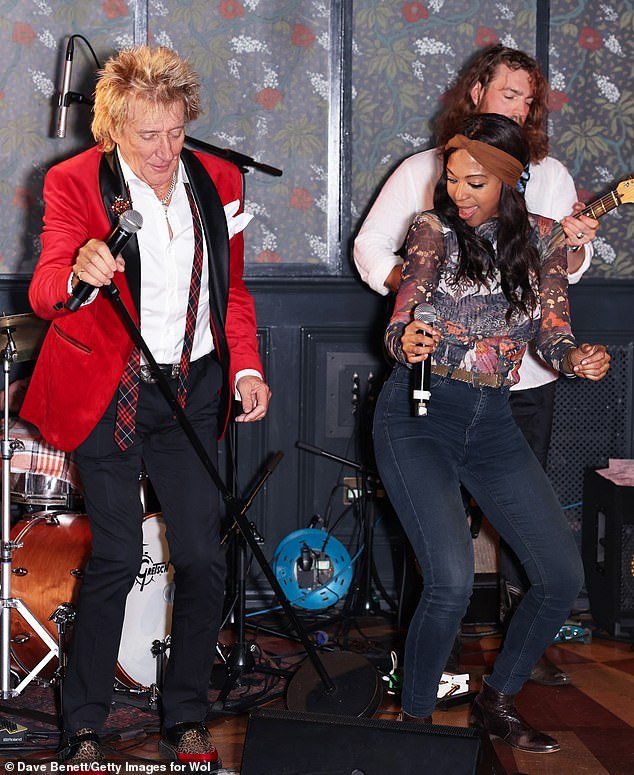 Busting a move: The star was spotted dancing alongside fellow singer Acantha Lang at the party in London