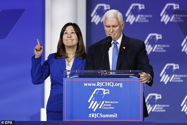 Pence invited his wife and former Second Lady Karen Pence (left) to the stage on Saturday as he thanked his campaign team and family for their support during the presidential bid