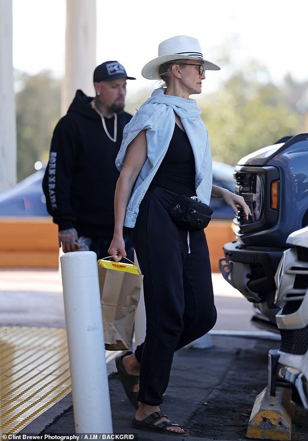 Shopping in Santa Barbara: After a successful shopping trip, she was spotted walking to their car with a bag of treats in her hand as Madden, 44, followed closely behind her