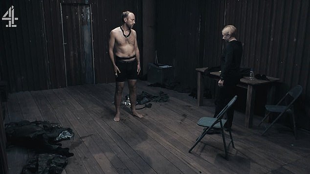 Shock: In the clip, he is forced to stand up in just his underwear as the interrogator shouts, 