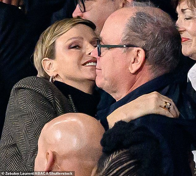 The royal, 45, was spotted cheering and hugging her Prince Albert as he congratulated her on her home country's victory against New Zealand at the Stade de France on Saturday evening.