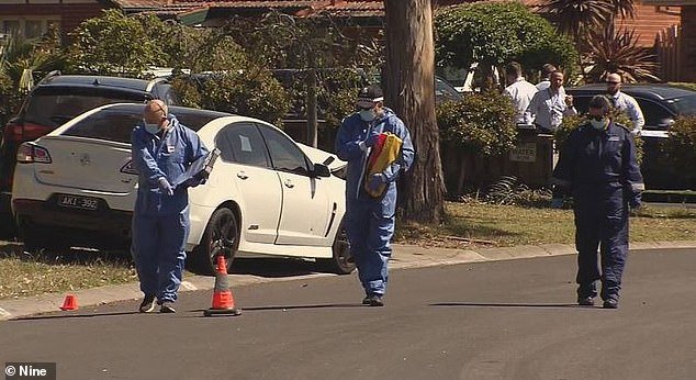 Police are investigating whether a conflict between the female victim and her ex-partner was a possible motive for the shooting (photo, forensic investigators analyze the crime scene)